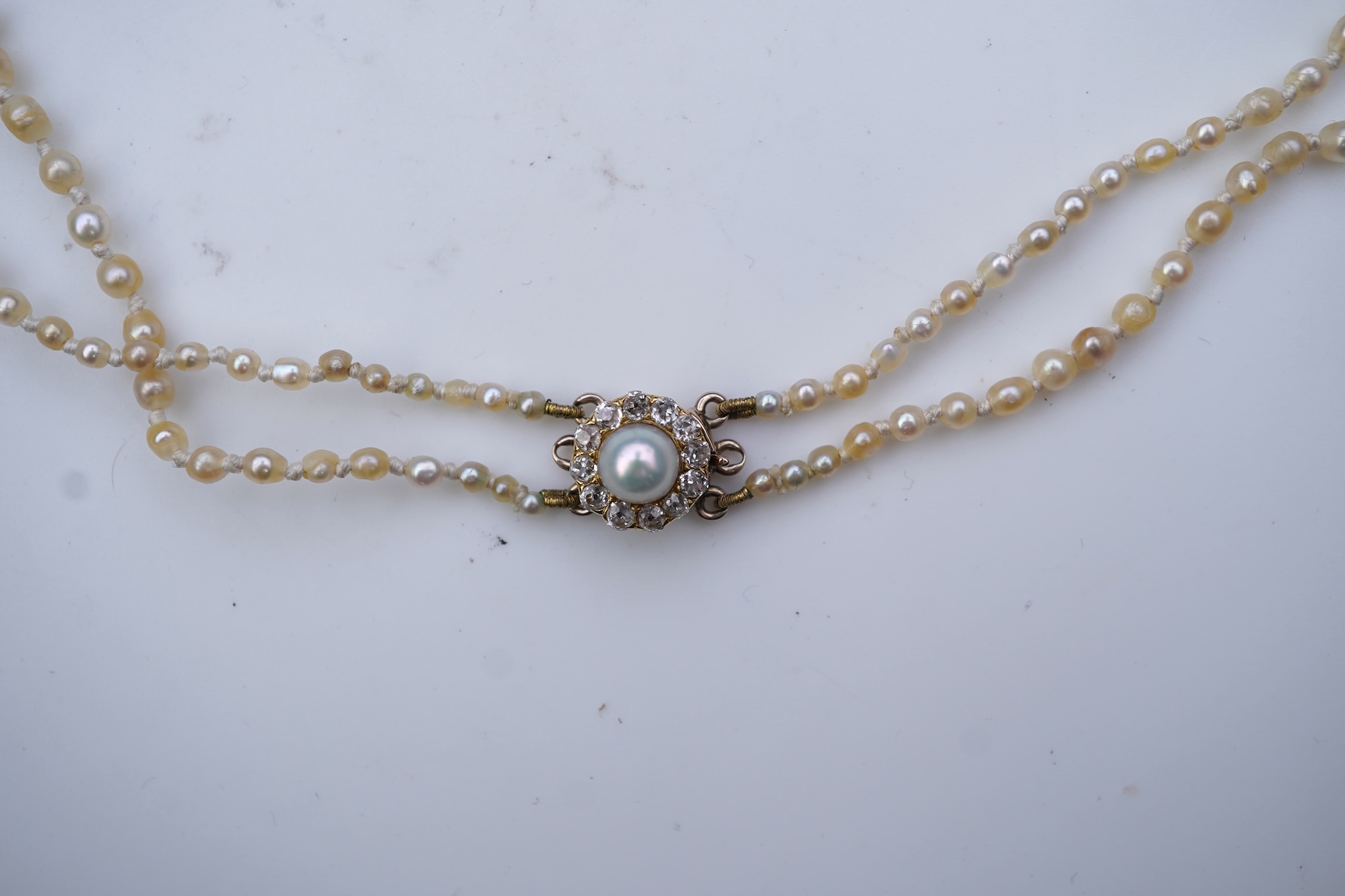A natural pearl and diamond necklace, early 20th century